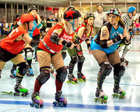 Colorfully Dressed In Both Expression And Attire, Roller Derby Woman, "Breasaurus" Of The Twin City Knockers Prepares To Block in this dramatic event photograph by Brian Buckner Photography.