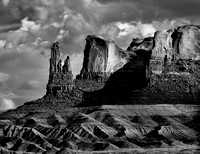 Rock Formations At The End Of A Buttressed Plateau In Utah's High Desert Look Like A Family Standing Guard In This Black And White Commercial Landscape Photograph By Brian Buckner Photography.