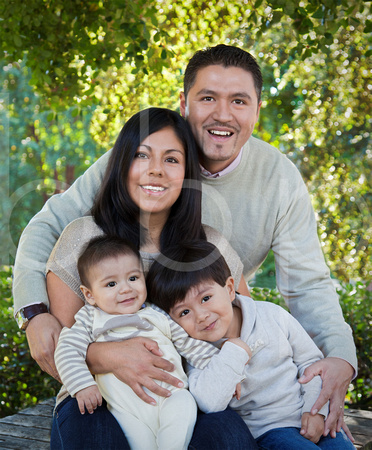This Is A Family Photograph of a Man, His Wife, and Their Two Sons.  The boys are young and everyone is smiling in this beautiful family photograph by brian Buckner Photography, Shreveport, Louisiana.