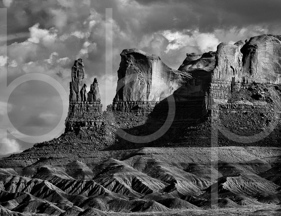 Rock Formations At The End Of A Buttressed Plateau In Utah's High Desert Look Like A Family Standing Guard In This Black And White Commercial Landscape Photograph By Brian Buckner Photography.