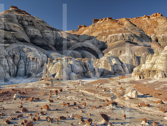 Clay And Sandstone Form A Surreal Lunar-Like Landscape With Pedestal Formations Called Hoodoos At The Bist/De-Na-Zin Wildermess in this commercial landscape photograph by Brian Buckner Photography.